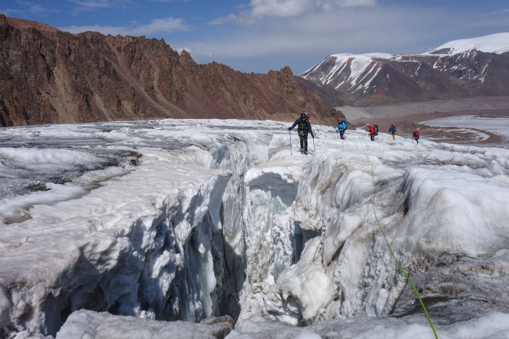 Crossing crevasses at Korzhenevskogo glacier